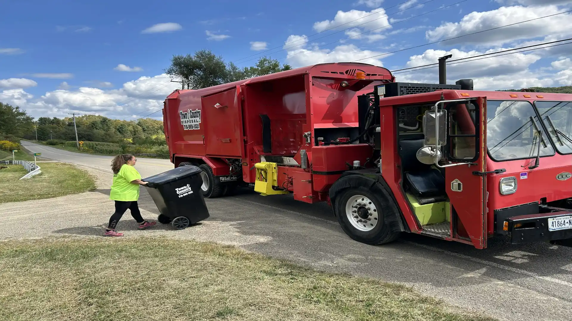 Town & Country Disposal truck providing residential trash pickup in Collins, NY - Weekly curbside trash collection in Collins, New York