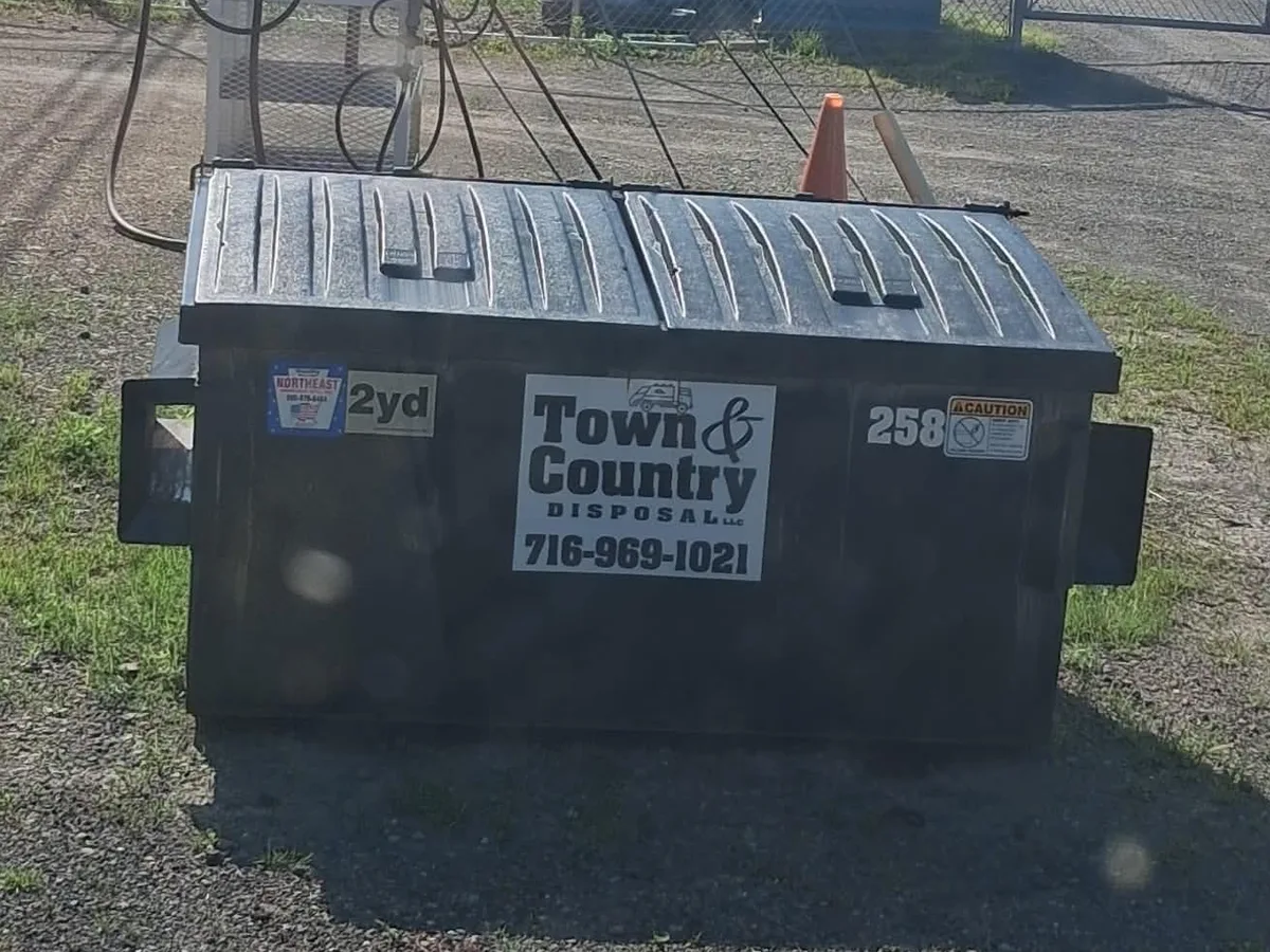 2 yard Town & Country Disposal commercial front-load dumpster at a Western New York business