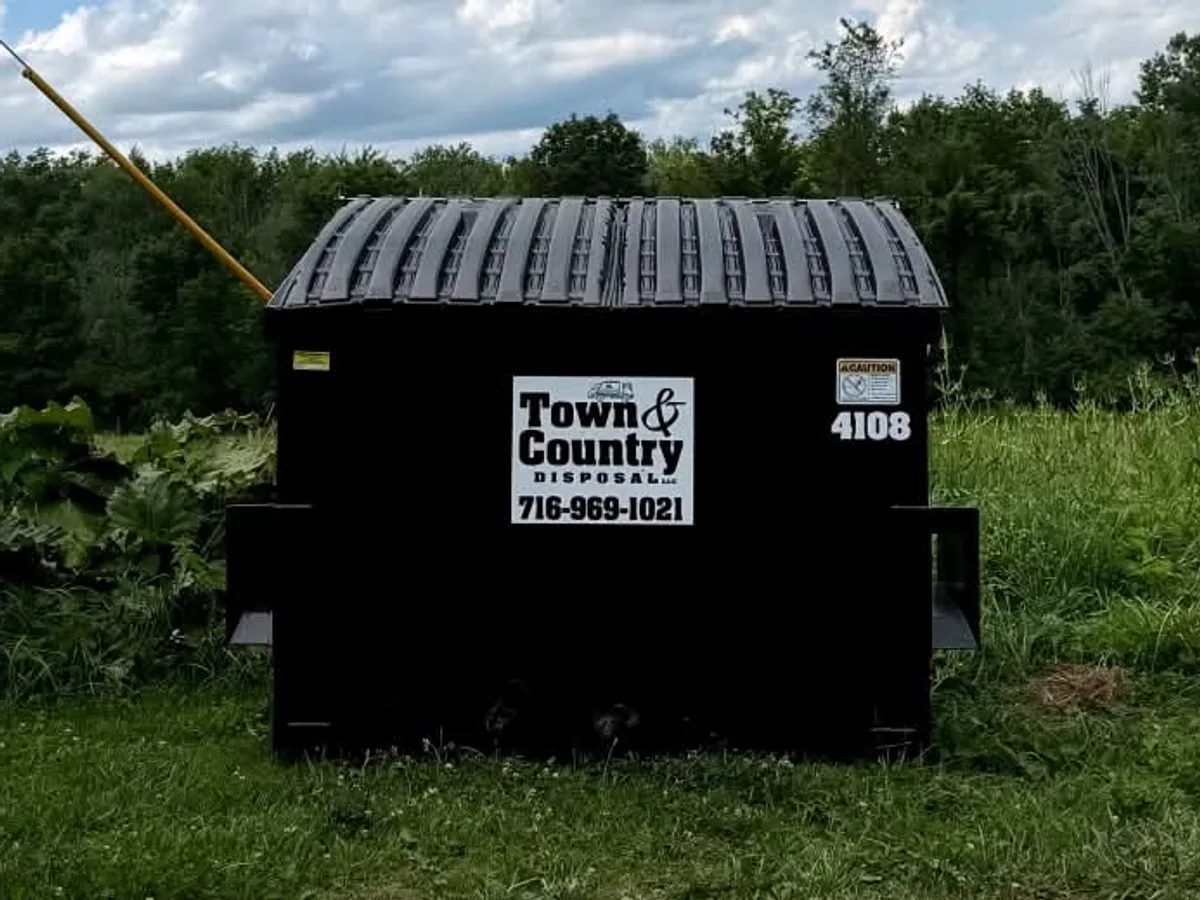 4 yard Town & Country Disposal commercial front-load dumpster placed on site in Western New York