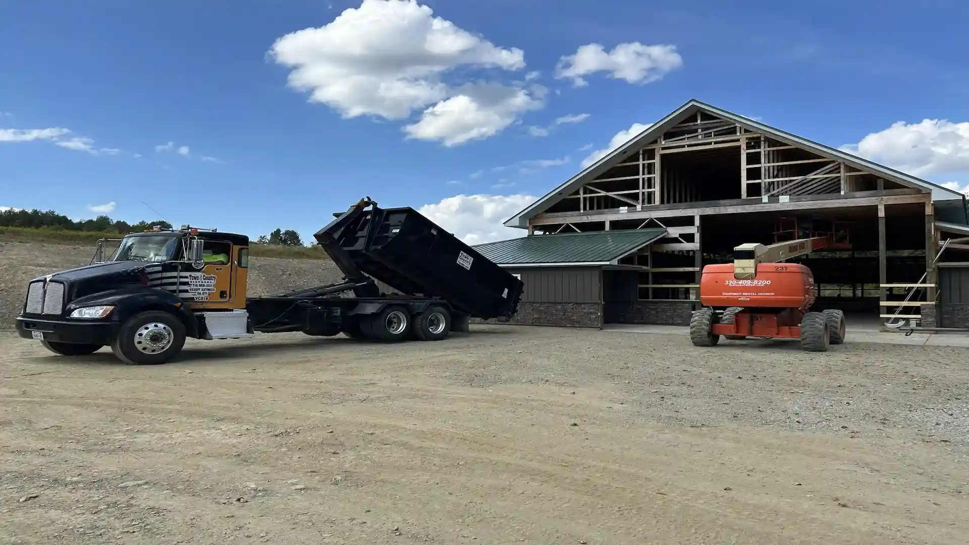 Town & Country Disposal truck providing residential trash pickup in Gowanda, NY - weekly curbside trash collection
